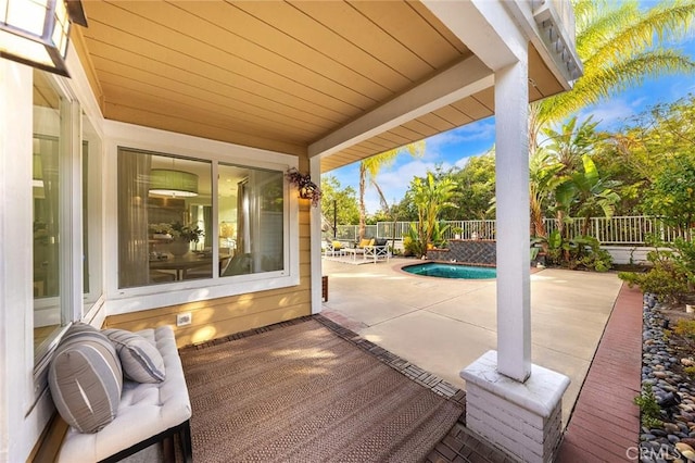 view of patio / terrace with a fenced in pool