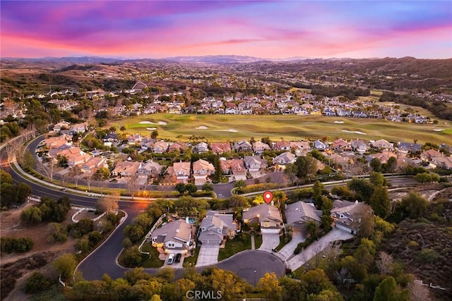 aerial view at dusk with a mountain view