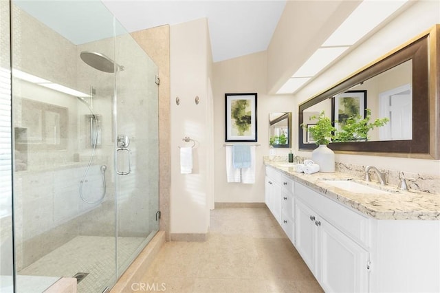 bathroom with vanity, an enclosed shower, and tile patterned floors