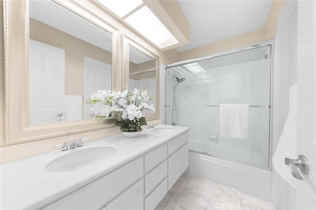 bathroom featuring vanity and shower / bath combination with glass door