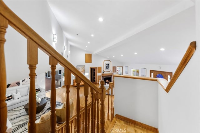 stairway with lofted ceiling and parquet flooring