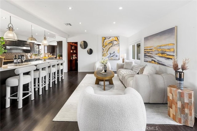 living room with dark hardwood / wood-style floors