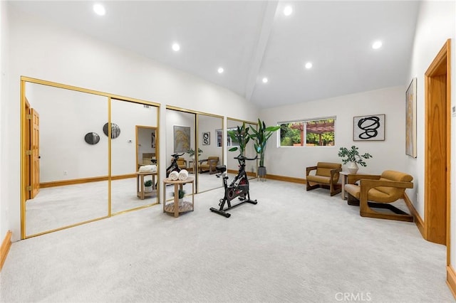 workout area with light carpet and high vaulted ceiling