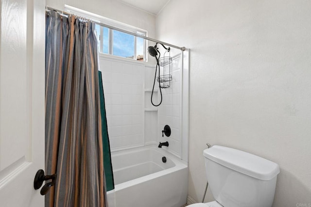 bathroom with toilet and shower / bath combo with shower curtain