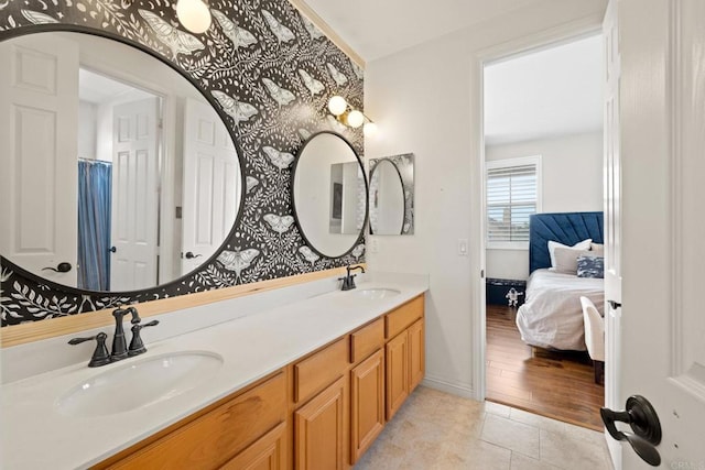 bathroom featuring tile patterned floors and vanity