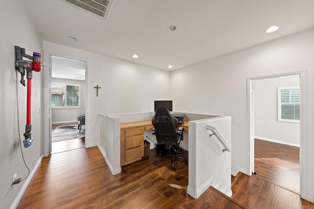 office with dark hardwood / wood-style floors