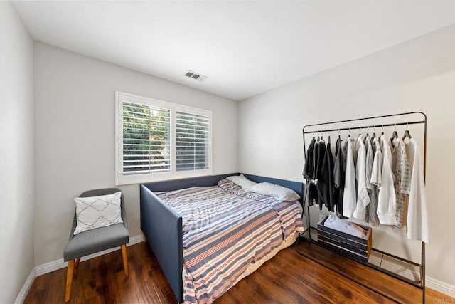 bedroom featuring dark wood-type flooring