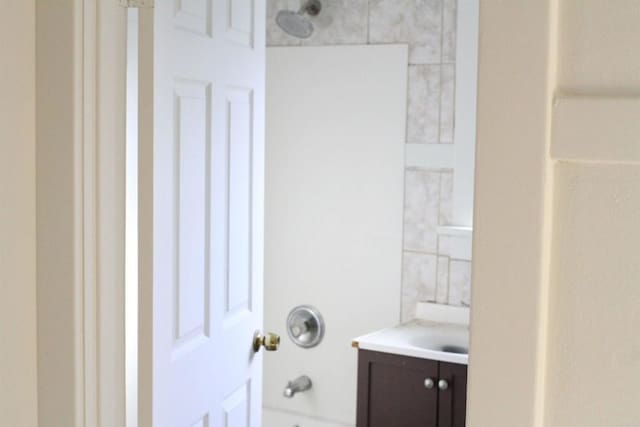 bathroom featuring vanity and tub / shower combination