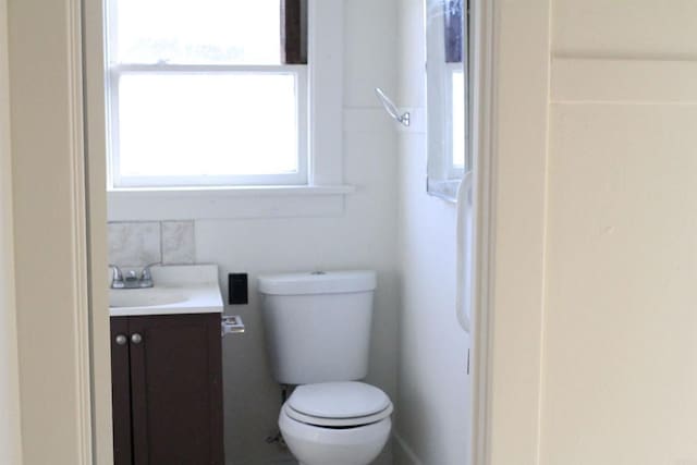 bathroom featuring vanity and toilet