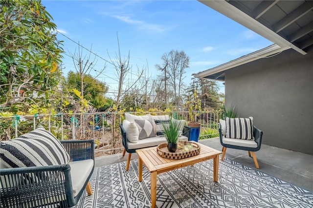 view of patio with a balcony and an outdoor living space