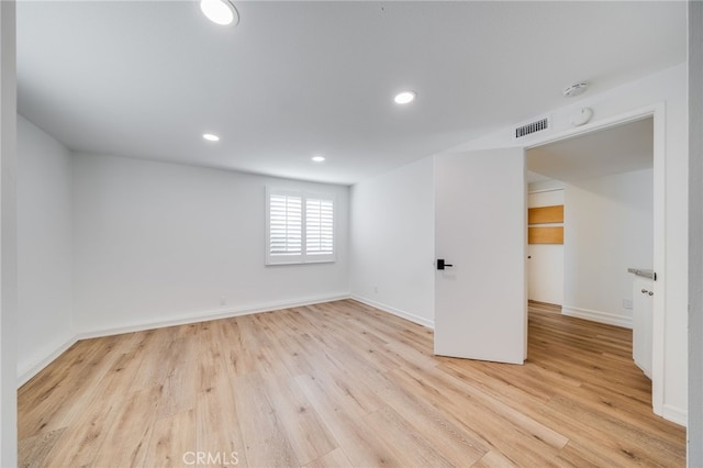 unfurnished room with light hardwood / wood-style floors