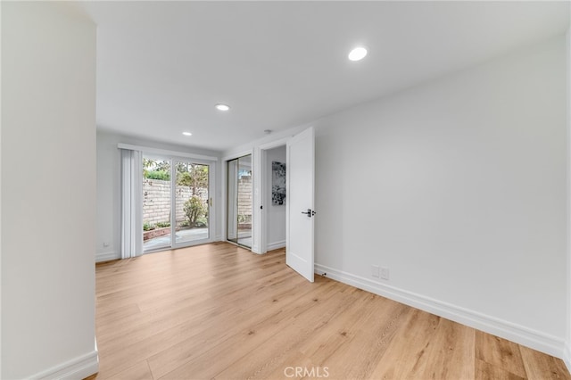 spare room featuring light wood-type flooring