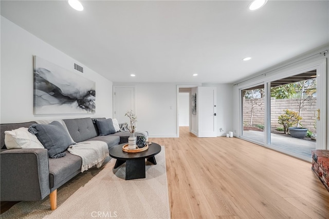 living room with light hardwood / wood-style flooring