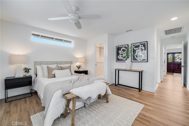 bedroom featuring ceiling fan and light wood-type flooring