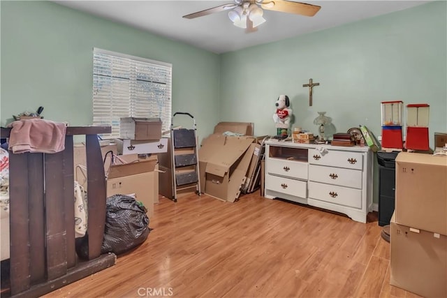 bedroom with light wood-style flooring and a ceiling fan