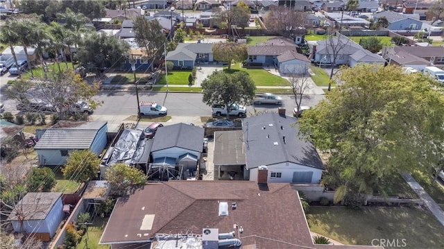 birds eye view of property with a residential view