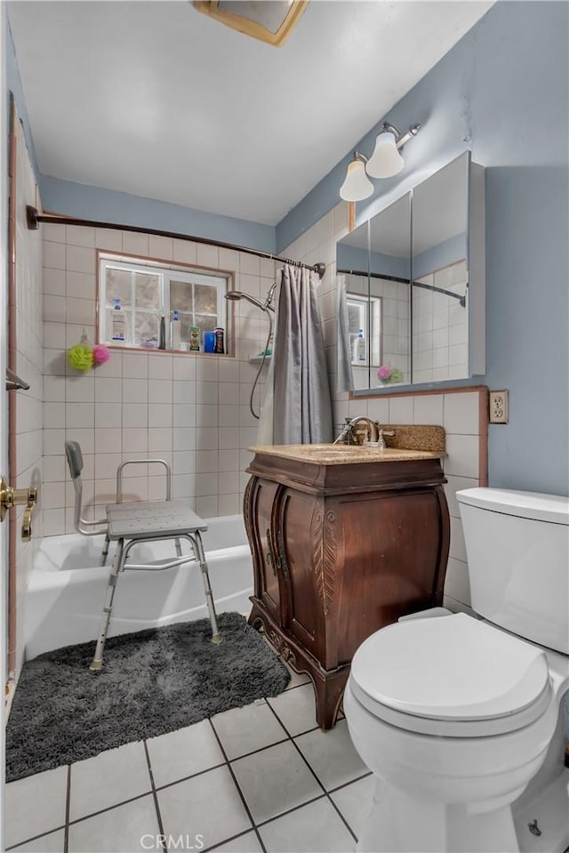 bathroom featuring toilet, tile patterned flooring, shower / bath combo, and vanity