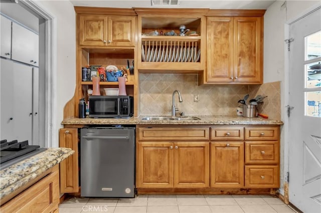 kitchen featuring dishwasher, light stone counters, a sink, black microwave, and backsplash