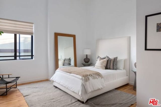 bedroom featuring hardwood / wood-style flooring