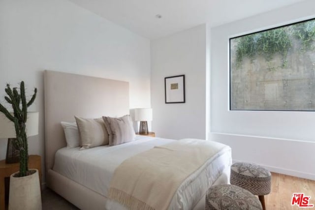 bedroom featuring hardwood / wood-style flooring