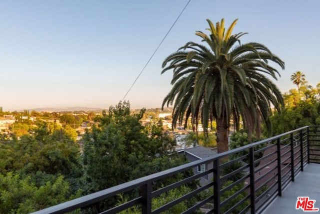 view of balcony at dusk