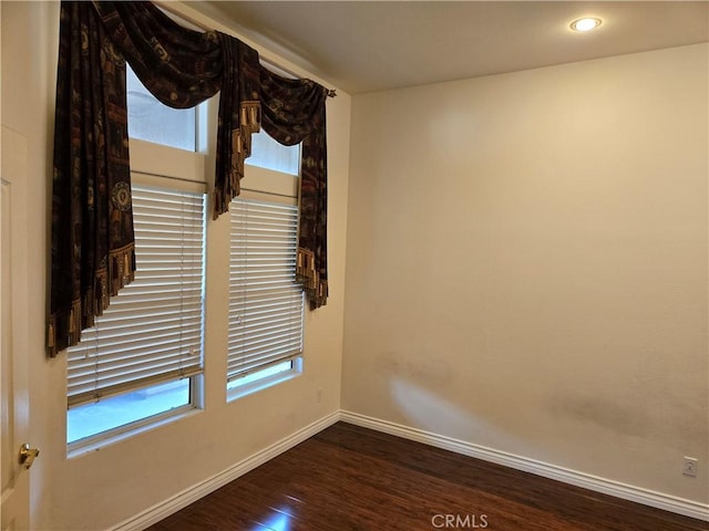 empty room featuring dark hardwood / wood-style floors