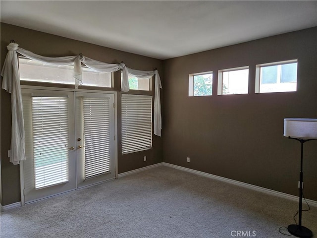 spare room featuring carpet flooring