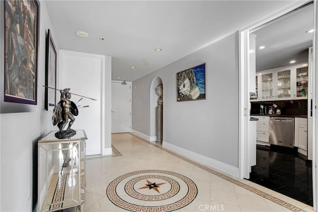 hallway with light tile patterned floors