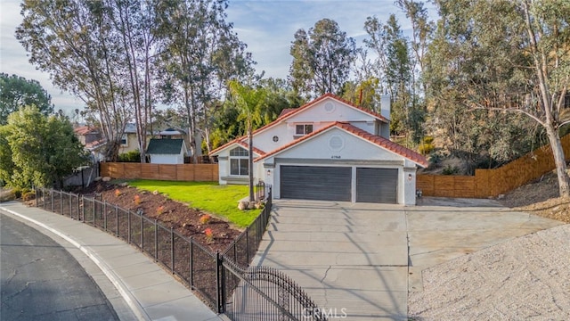 view of front facade featuring a garage and a front yard