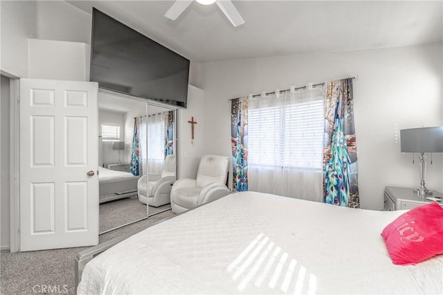 bedroom featuring lofted ceiling, carpet floors, and ceiling fan