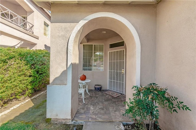 doorway to property featuring a patio