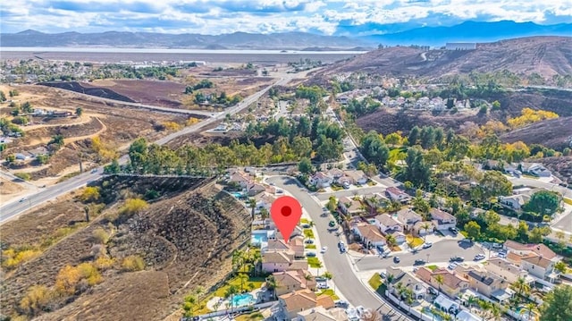 birds eye view of property featuring a mountain view