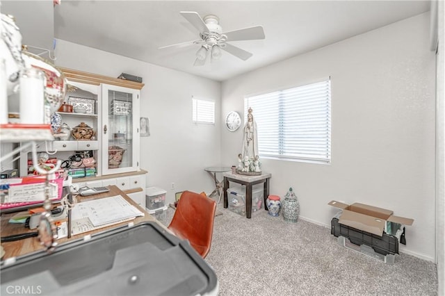 carpeted office with ceiling fan