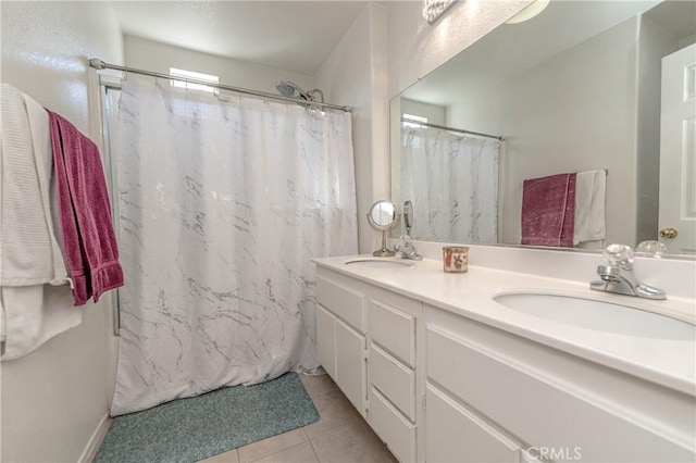 bathroom featuring tile patterned flooring, vanity, and a shower with shower curtain