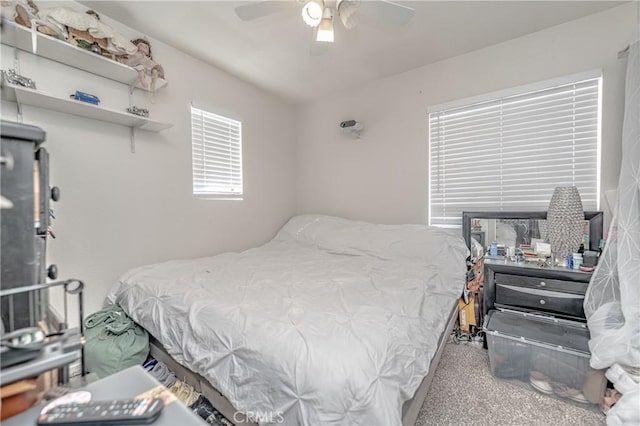 carpeted bedroom featuring ceiling fan