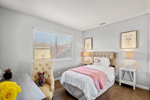 bedroom featuring dark wood-type flooring