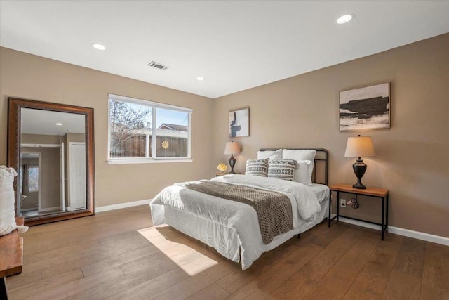 bedroom with hardwood / wood-style flooring