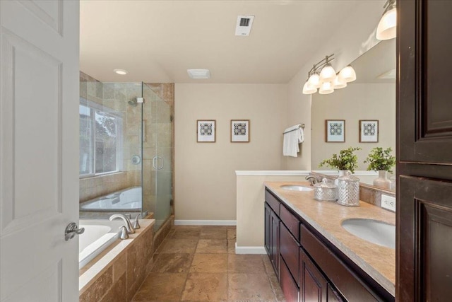 bathroom with vanity and separate shower and tub