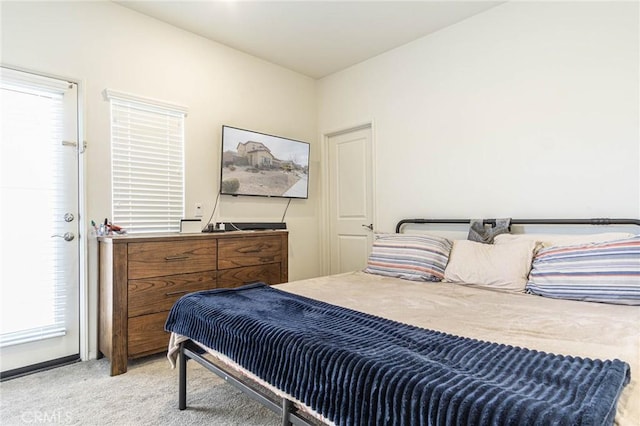 bedroom with light colored carpet