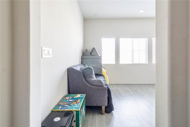 sitting room with light hardwood / wood-style floors