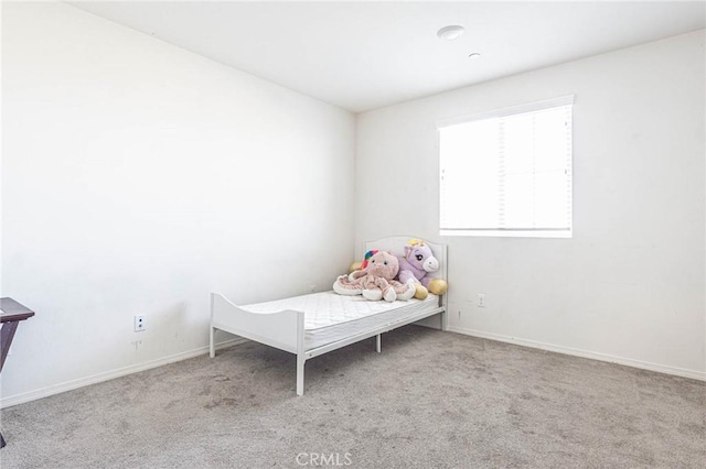 unfurnished bedroom featuring light colored carpet