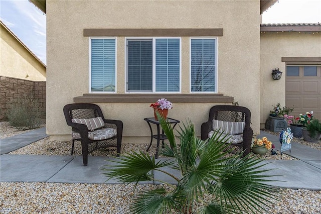 view of patio featuring a garage