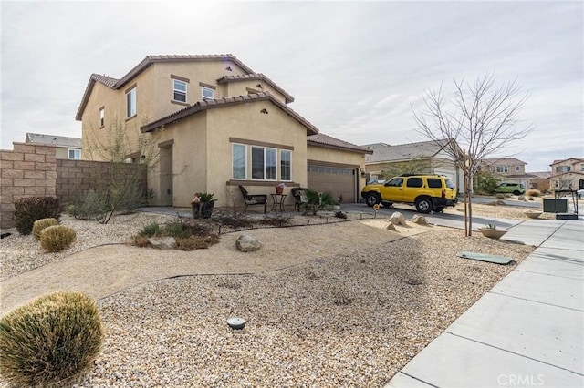 view of side of home with a garage