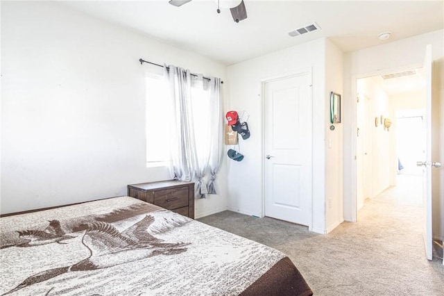 bedroom featuring ceiling fan and light colored carpet