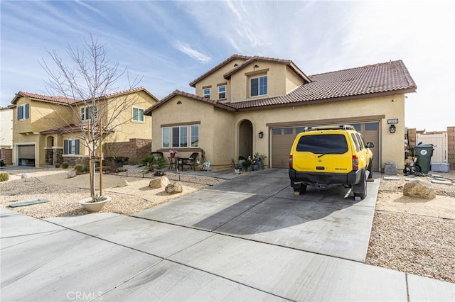 mediterranean / spanish-style home featuring a garage