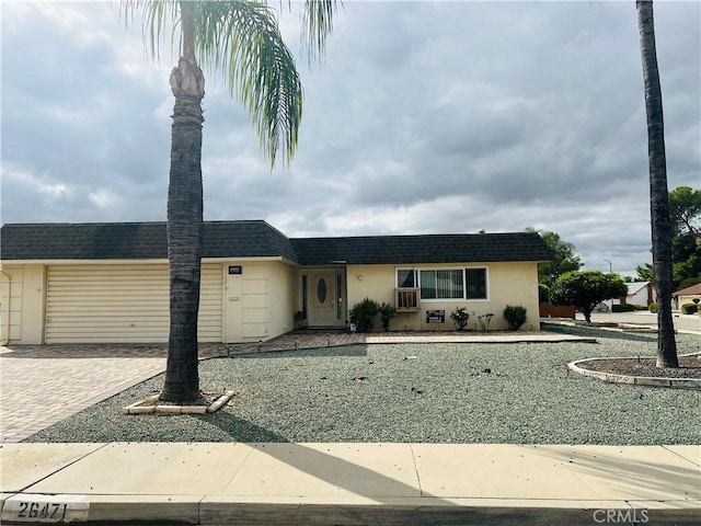 single story home featuring a garage