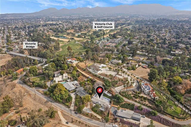 birds eye view of property with a mountain view