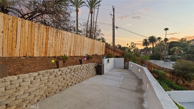 view of patio terrace at dusk