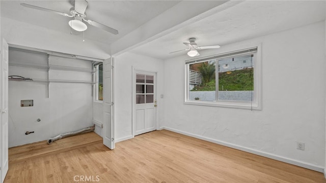 unfurnished bedroom with wood-type flooring, a closet, and ceiling fan