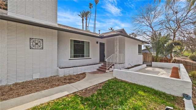 property entrance with a patio